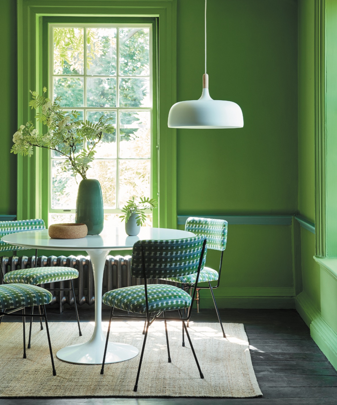 Designer green dining room with detailed interior paint and trim