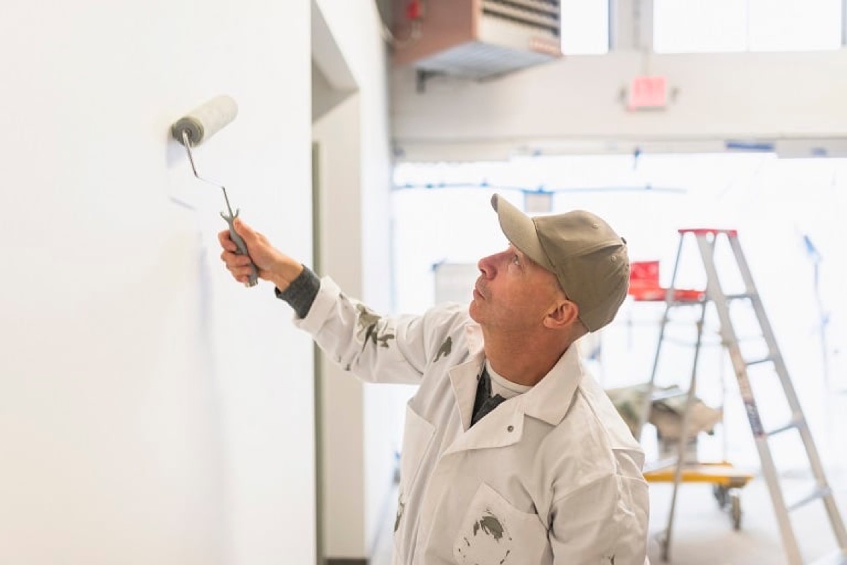 Interior painters Raleigh NC applying paint in a finished home